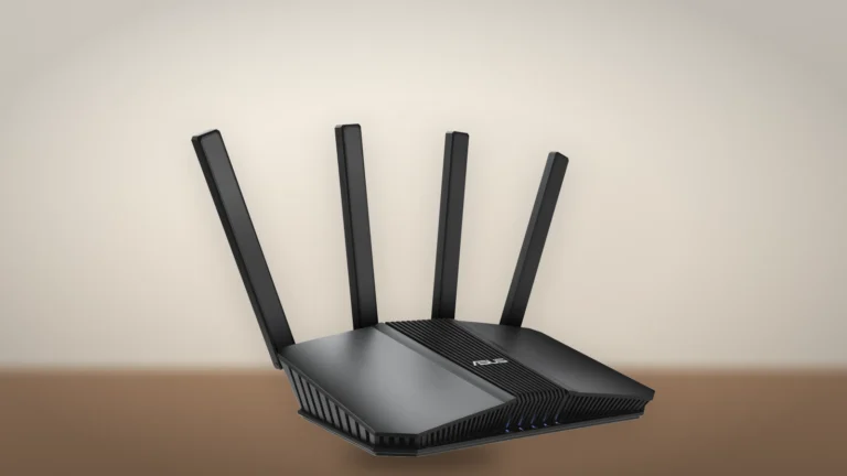 ASUS RT-BE82U router seen from the front left at an angle on a wooden surface, antennas raised